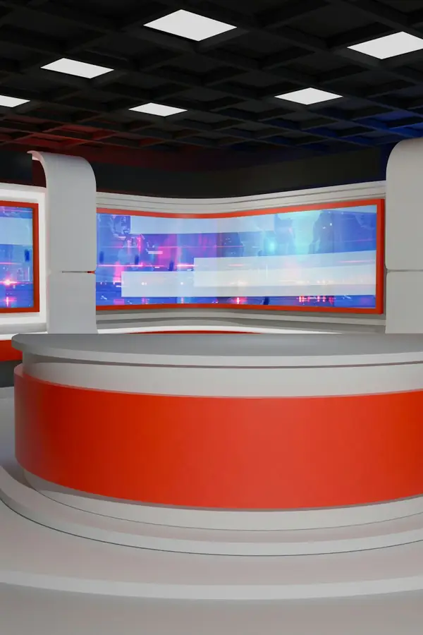 Set de un estudio de noticias con mesa roja y pantallas